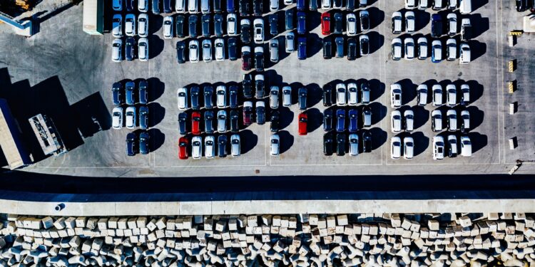 Aerial view of used cars lined up in the port