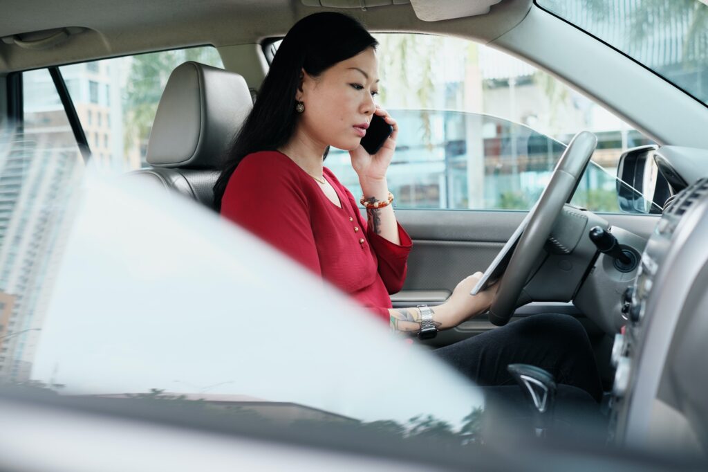 Business People Working In Car And Talking On Cell Phone