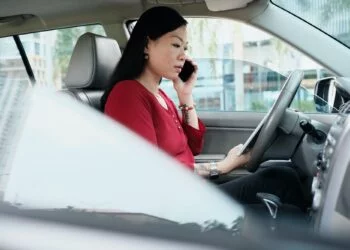 Business People Working In Car And Talking On Cell Phone