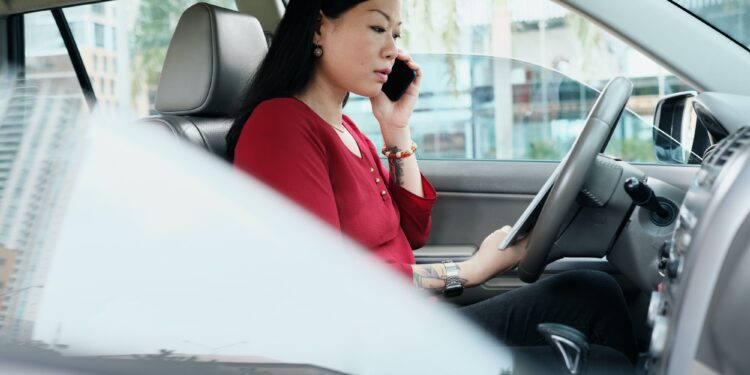 Business People Working In Car And Talking On Cell Phone