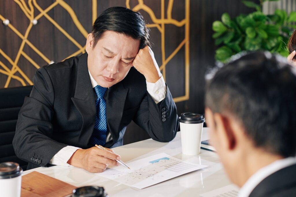 Businessman examining financial report