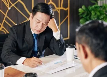 Businessman examining financial report