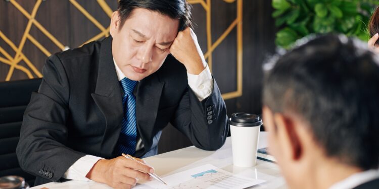 Businessman examining financial report