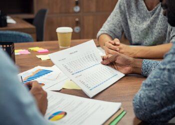 Businessman reading annual report