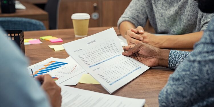 Businessman reading annual report