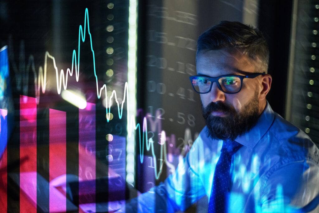 Businessman with computer working late. Financial crisis and coronavirus concept