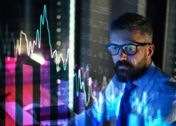 Businessman with computer working late. Financial crisis and coronavirus concept