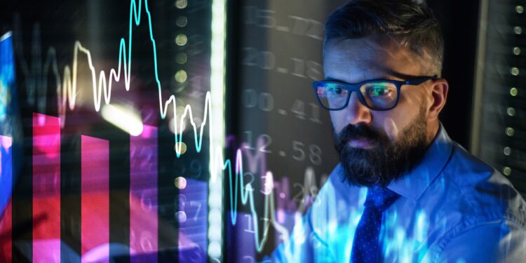 Businessman with computer working late. Financial crisis and coronavirus concept