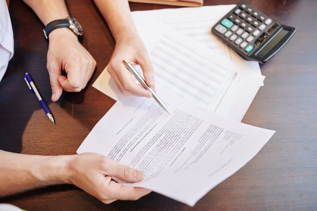 Businessmen checking partnership agreement