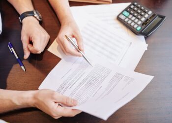Businessmen checking partnership agreement