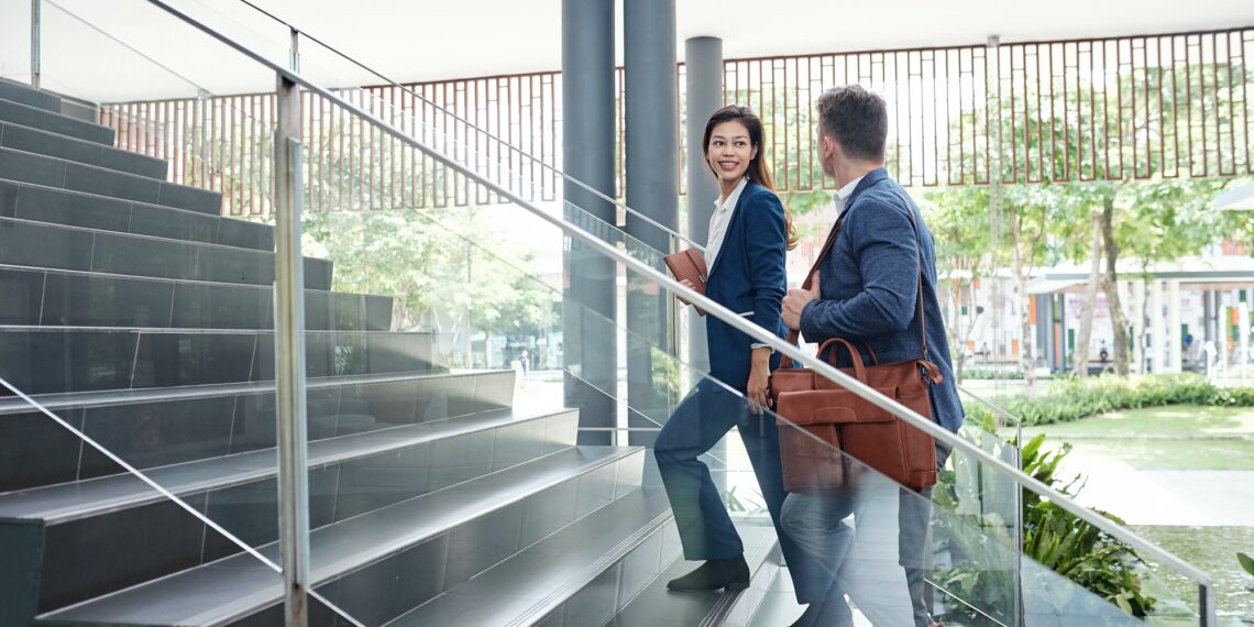 Rise in Faltering Businesses in Asia Pacific, Recovery Under Way 1 Colleagues walking up the stairs