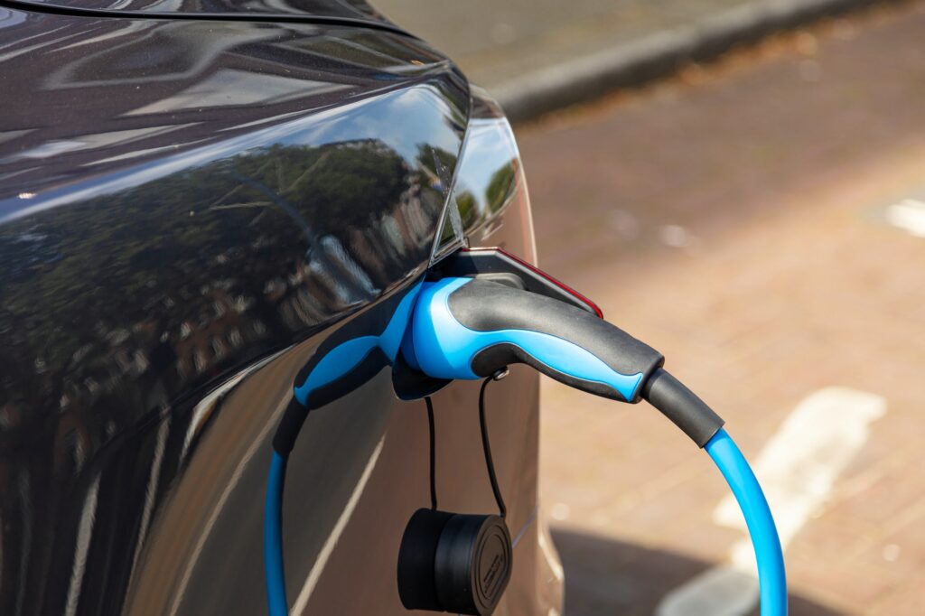 Electric car battery charging at a charge station, closeup view