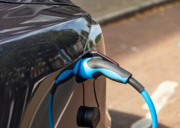 Electric car battery charging at a charge station, closeup view