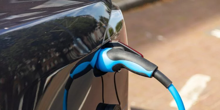 Electric car battery charging at a charge station, closeup view