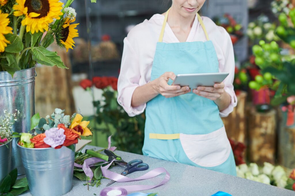 Florist Using Tablet in Shop