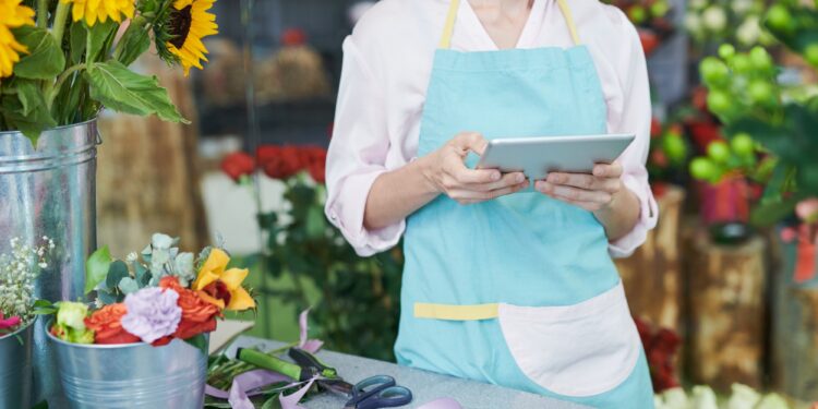 Florist Using Tablet in Shop