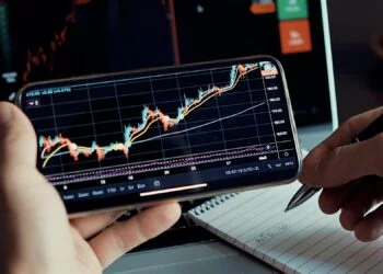 investment stockbroker stock market analysis data graph on smartphone