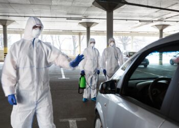 Medical worker in virus protective hazmat ban to leave