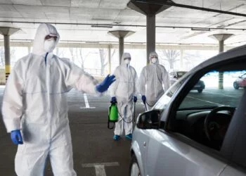 Medical worker in virus protective hazmat ban to leave