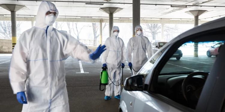 Medical worker in virus protective hazmat ban to leave