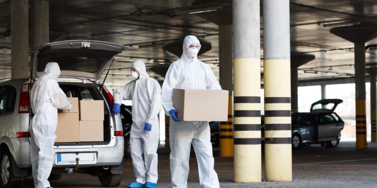 Medical workers delivering vaccine from coronavirus biohazard
