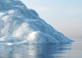 Melting iceberg on the ocean. Global warming and climate change