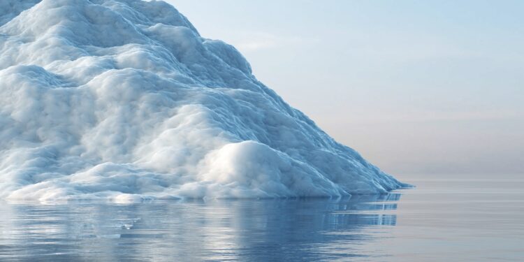 Melting iceberg on the ocean. Global warming and climate change