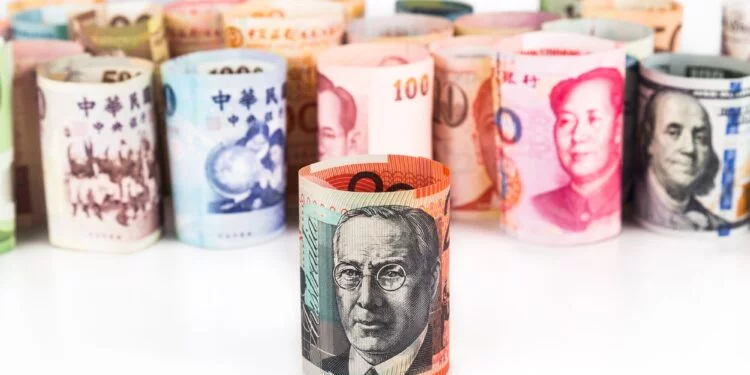 Pile of rolled-up currency notes with Australian Dollar in front