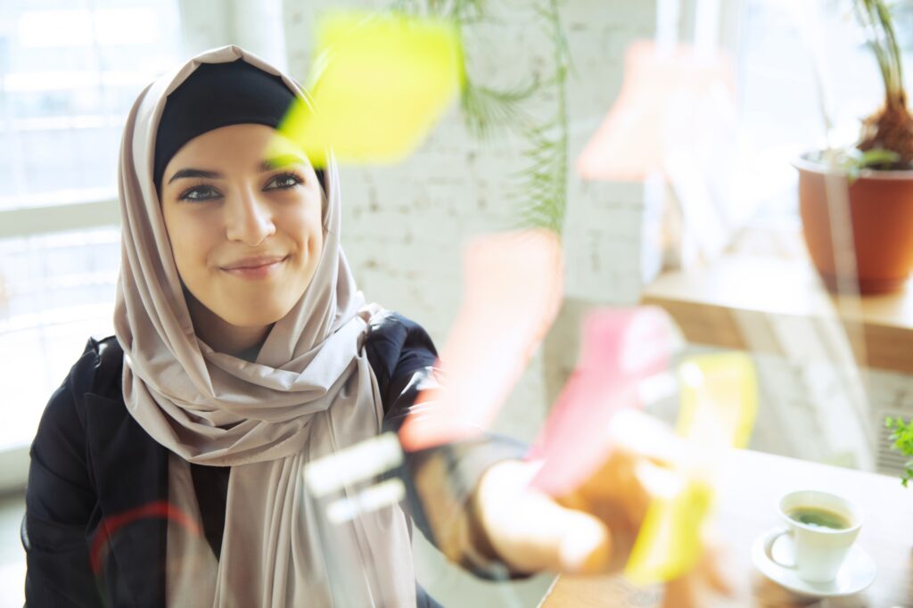 Portrait of a beautiful arabian businesswoman wearing hijab while working