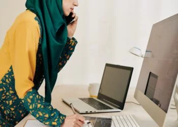 Serious businesswoman talking on phone