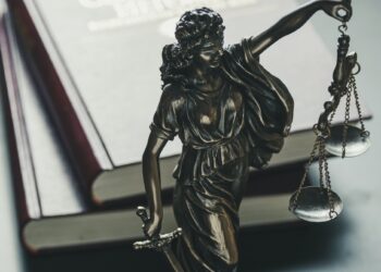 Statue of the figure of Justice holding scales