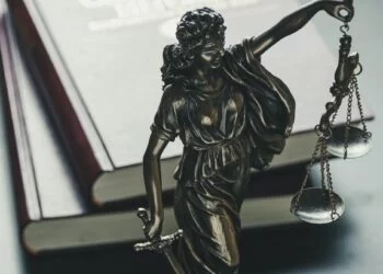 Statue of the figure of Justice holding scales