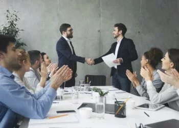 Striking grand deal. Business people congratulating their colleagues