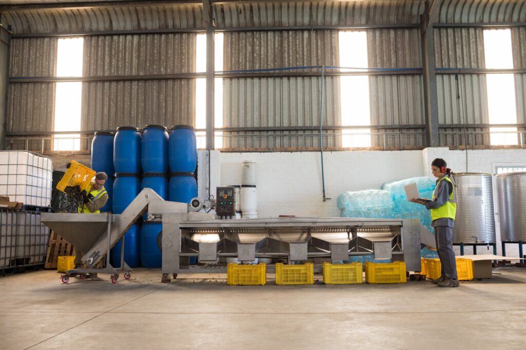 Workers working together near production line