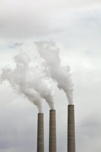 Smoke Coming From Three Smokestacks - The present Global challenges impacting the future